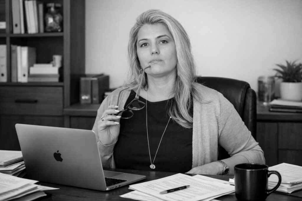 Services Laura Dohanes, CPA, at her desk